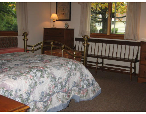 30 Laurelwood Road Rutland, MA 01543 - Photo 13 of 21 a bed sitting in a bedroom next to a window
