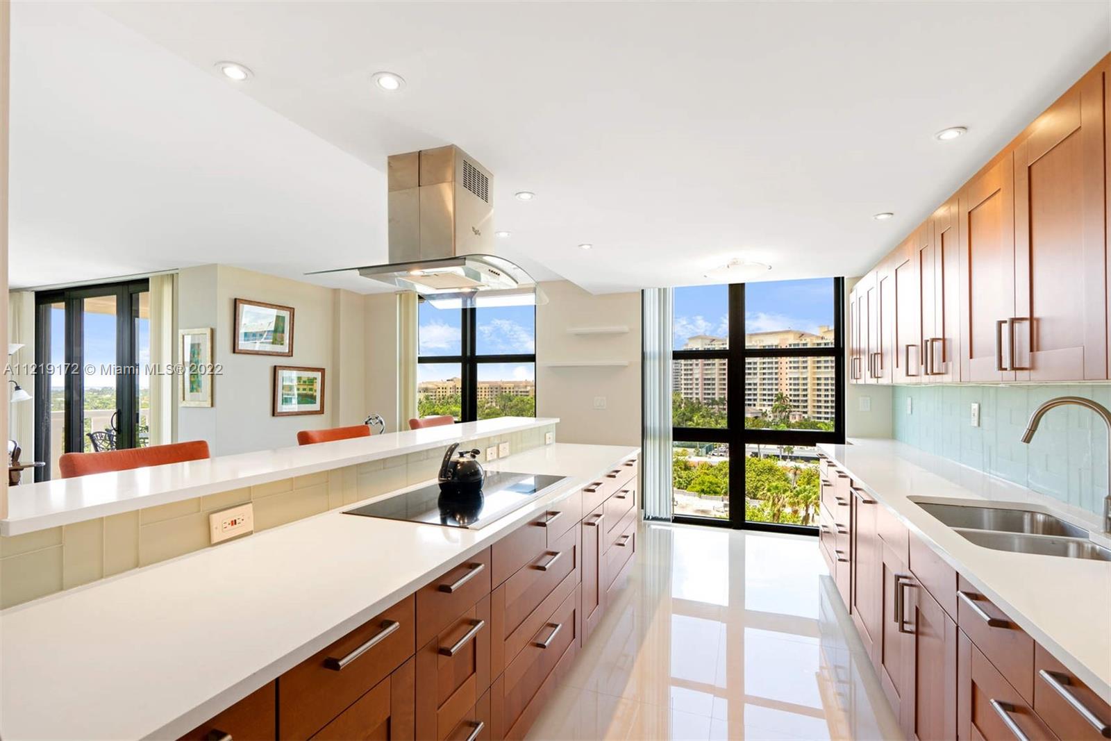 1121 Crandon Boulevard, Unit E801 Key Biscayne, FL 33149 - Photo 11 of 29 a large kitchen with a large window