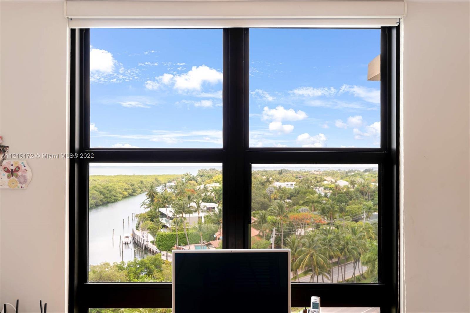 1121 Crandon Boulevard, Unit E801 Key Biscayne, FL 33149 - Photo 17 of 29 a view of a room with large windows