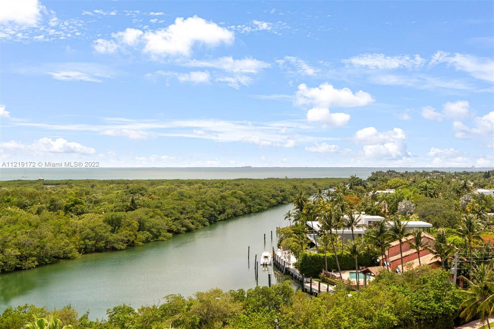 1121 Crandon Boulevard, Unit E801 Key Biscayne, FL 33149 - Photo 19 of 29 a view of a lake with houses