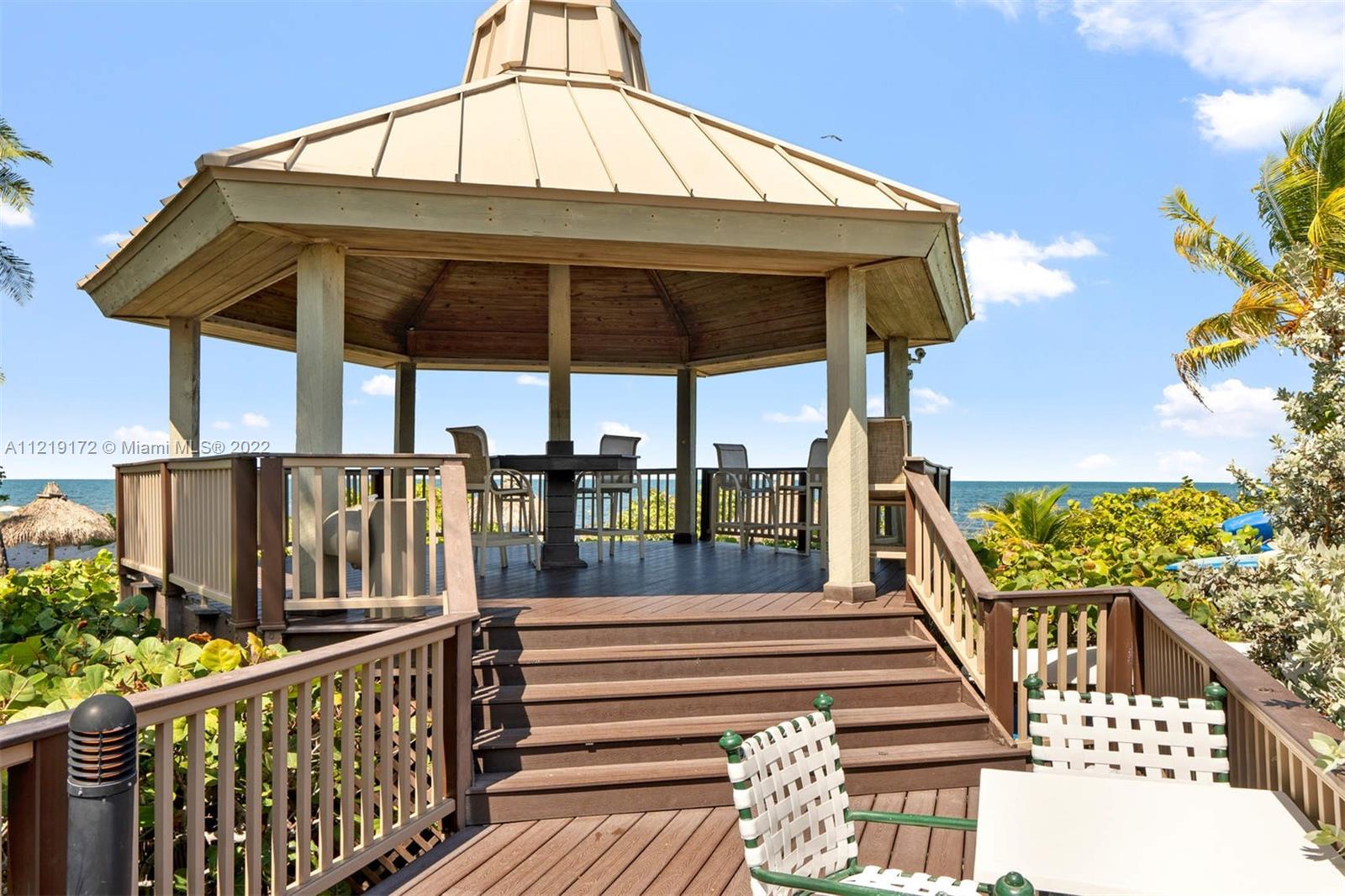 1121 Crandon Boulevard, Unit E801 Key Biscayne, FL 33149 - Photo 27 of 29 a view of a balcony with chairs