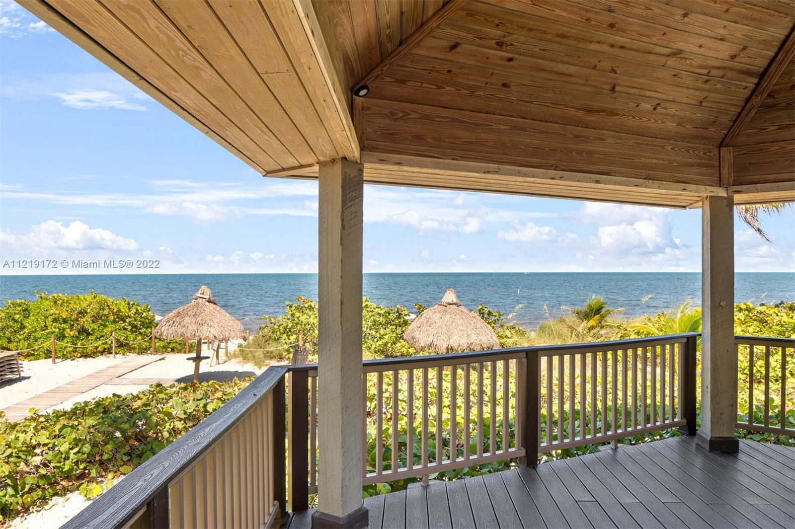 1121 Crandon Boulevard, Unit E801 Key Biscayne, FL 33149 - Photo 29 of 29 a view of a balcony with wooden floor