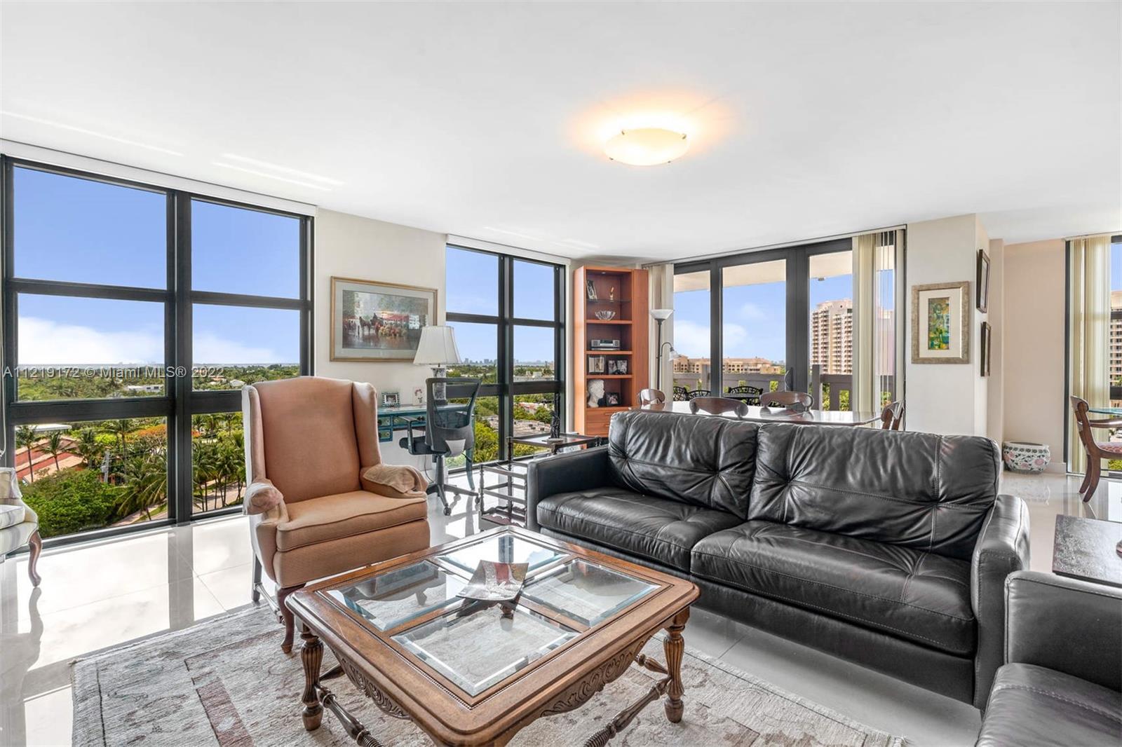 1121 Crandon Boulevard, Unit E801 Key Biscayne, FL 33149 - Photo 3 of 29 a living room with furniture and a large window