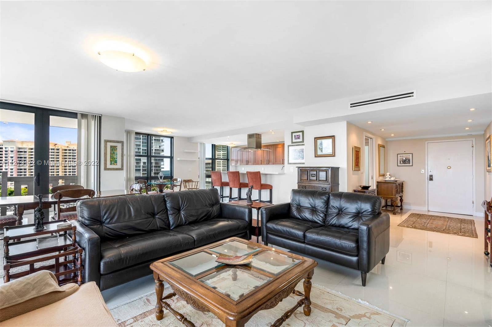 1121 Crandon Boulevard, Unit E801 Key Biscayne, FL 33149 - Photo 4 of 29 a living room with furniture and a large window