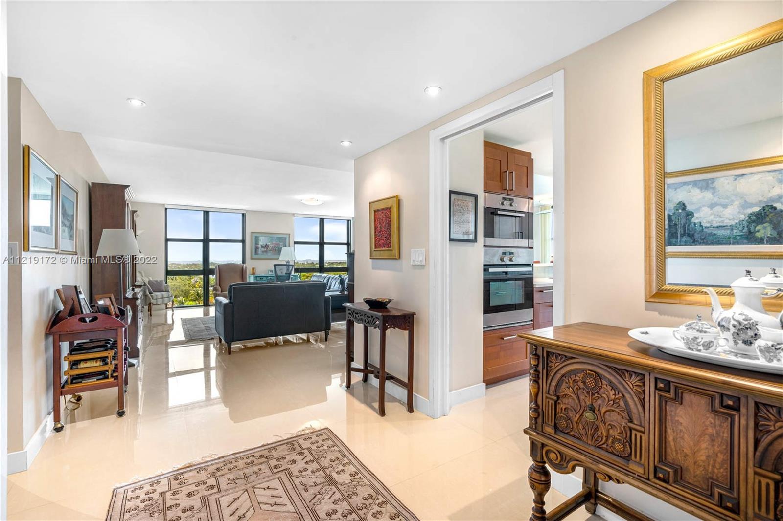 1121 Crandon Boulevard, Unit E801 Key Biscayne, FL 33149 - Photo 5 of 29 a bedroom with furniture and a window