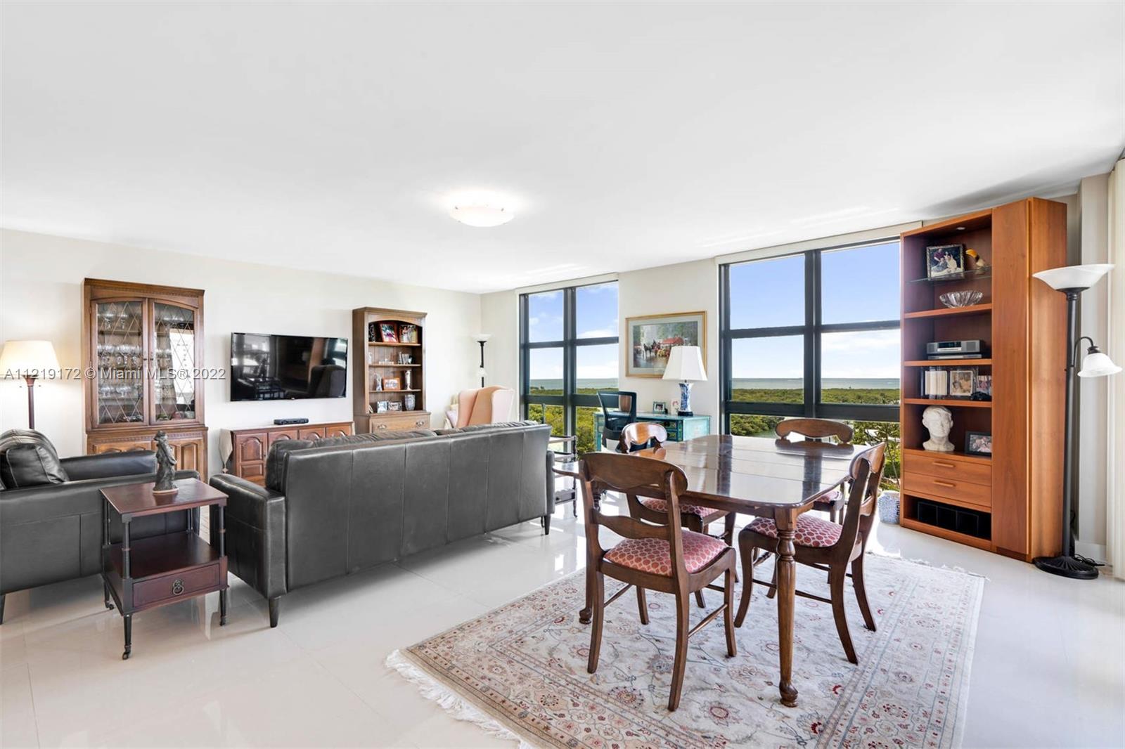 1121 Crandon Boulevard, Unit E801 Key Biscayne, FL 33149 - Photo 6 of 29 a view of a livingroom with furniture and a flat screen tv