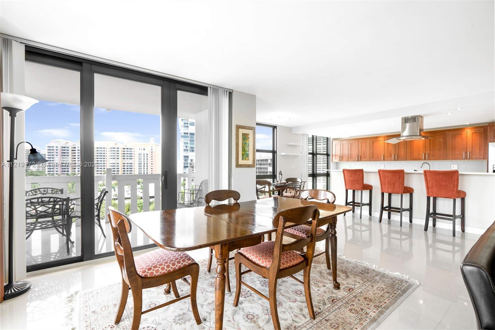 1121 Crandon Boulevard, Unit E801 Key Biscayne, FL 33149 - Photo 7 of 29 a dining room with furniture and wooden floor