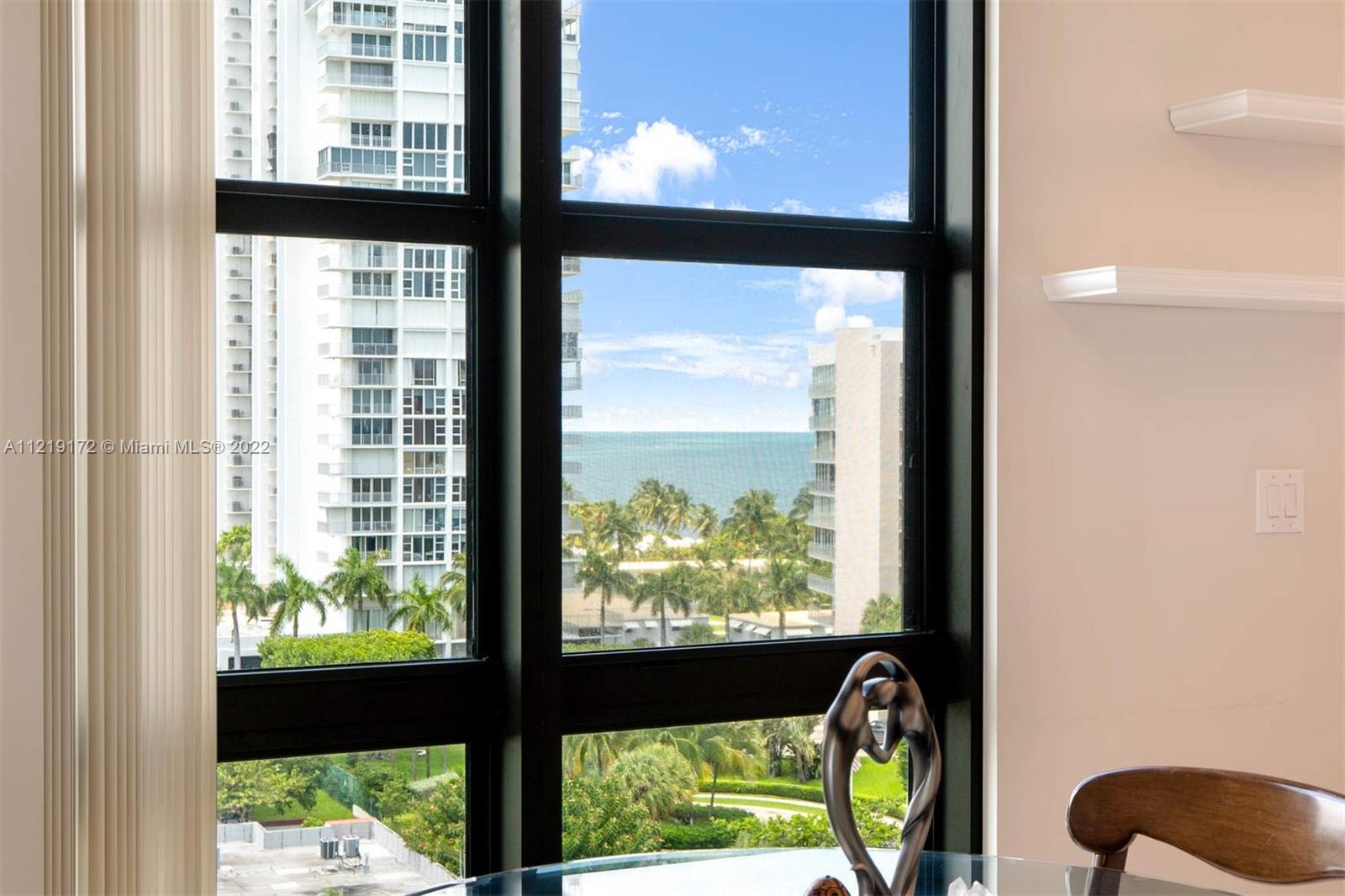 1121 Crandon Boulevard, Unit E801 Key Biscayne, FL 33149 - Photo 8 of 29 a view of a large window with an outdoor space