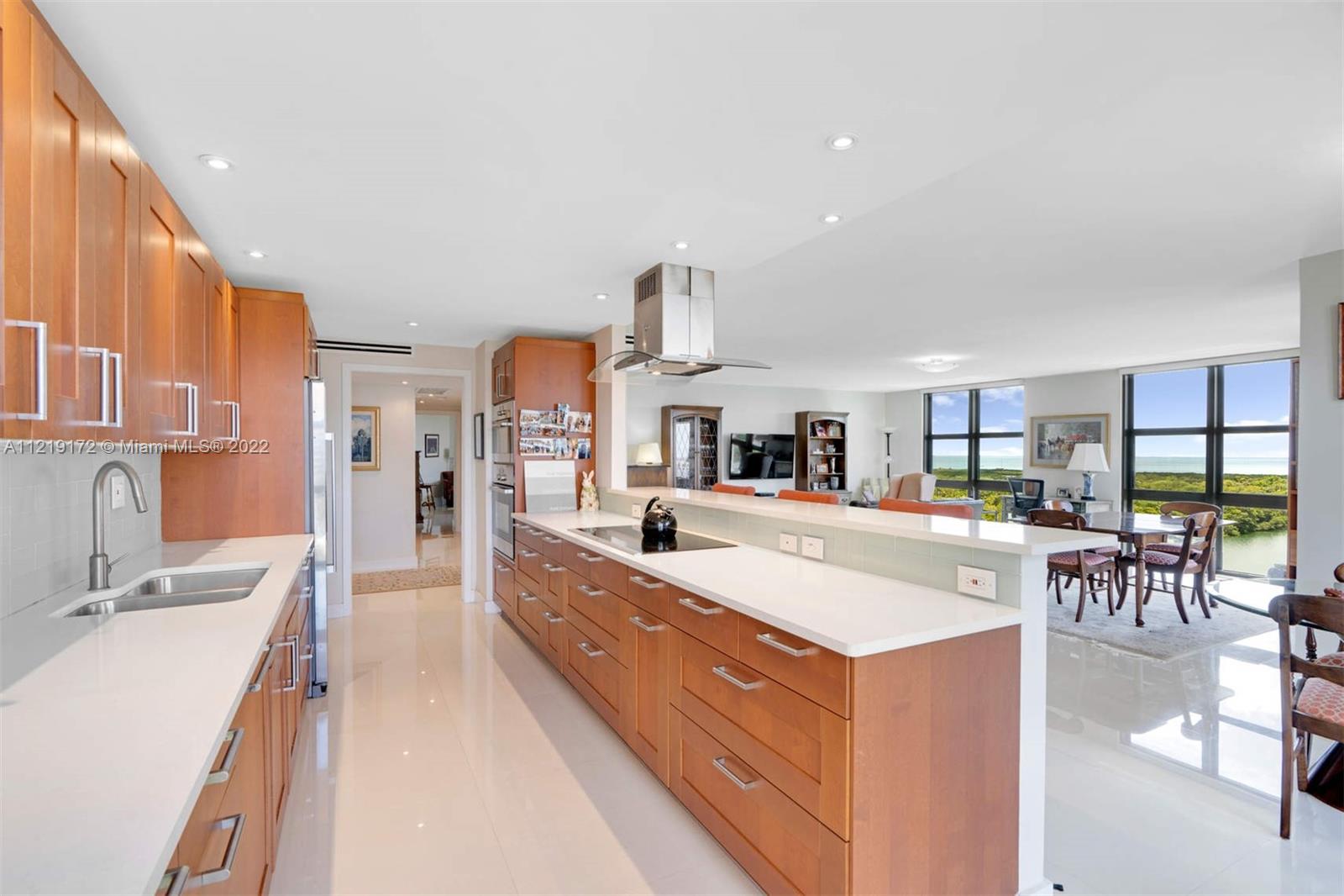 1121 Crandon Boulevard, Unit E801 Key Biscayne, FL 33149 - Photo 10 of 29 a large living room with stainless steel appliances granite countertop furniture and a kitchen view