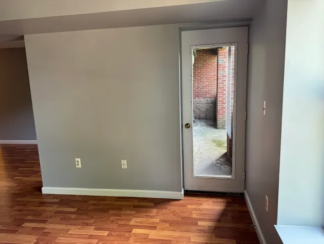 a view of a livingroom with wooden floor