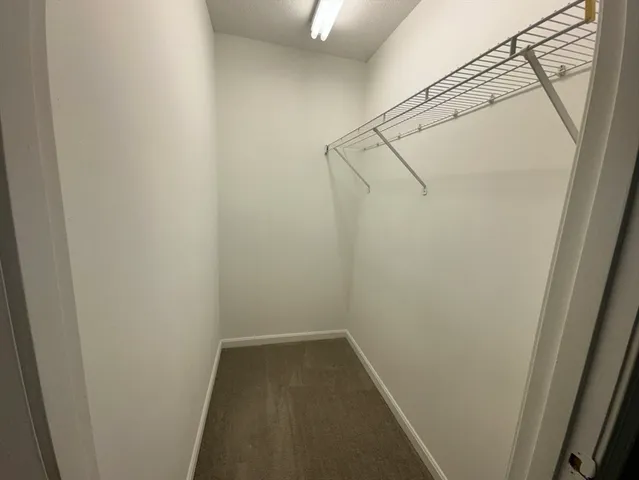 a view of a room with racks on the wall