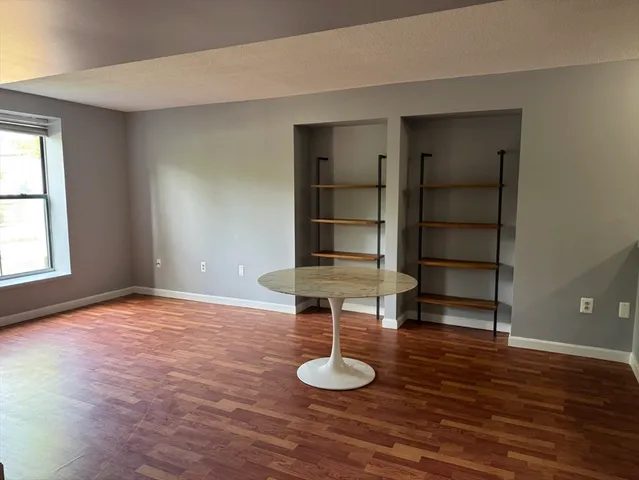 a view of a livingroom with furniture and wooden floor