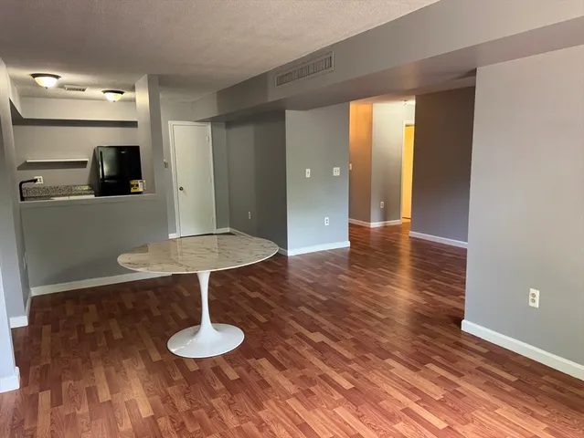 a view of kitchen with cabinets and wooden floor