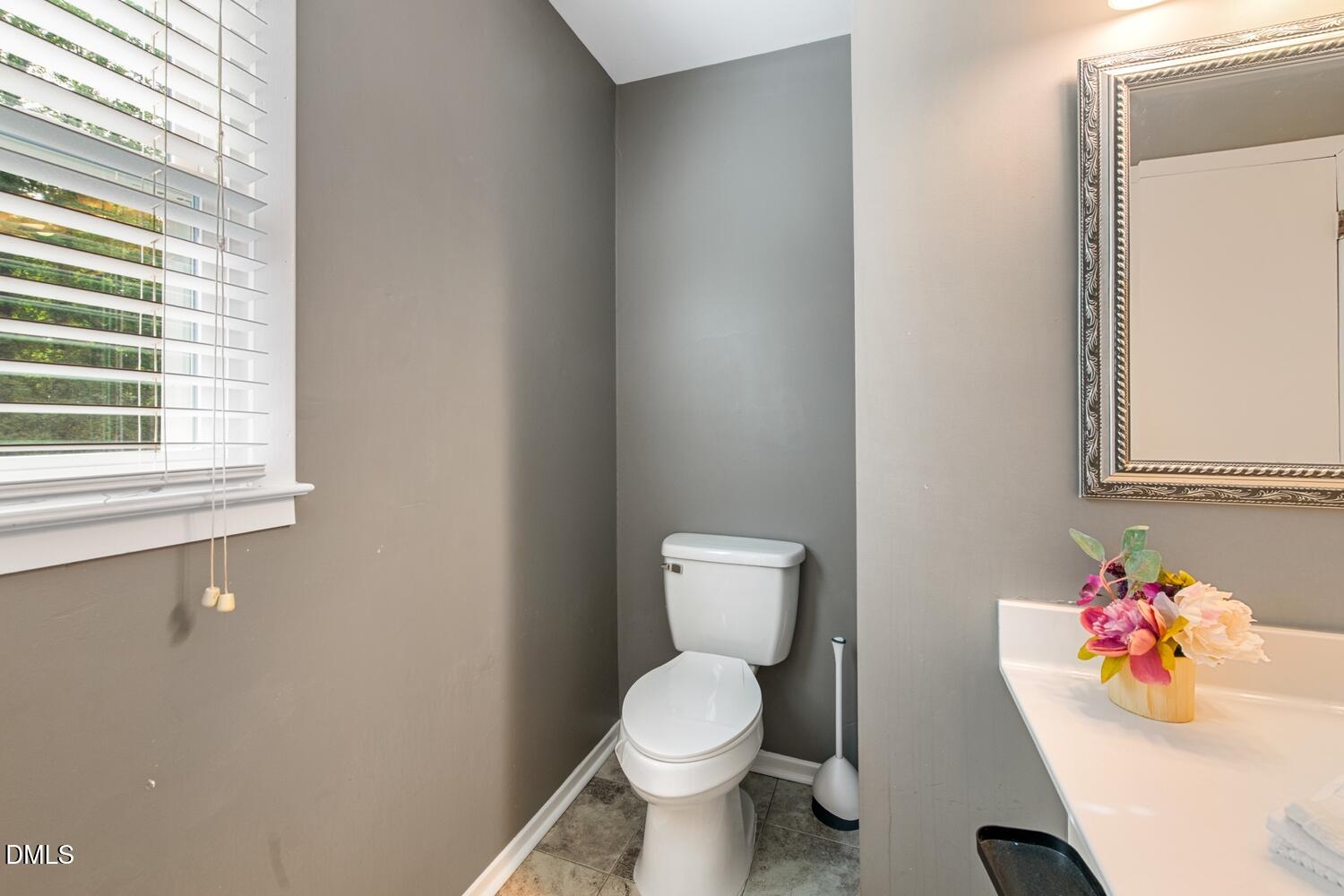 134 Longview Road Madison, NC 27025 - Photo 41 of 49 a bathroom with a toilet sink and a window