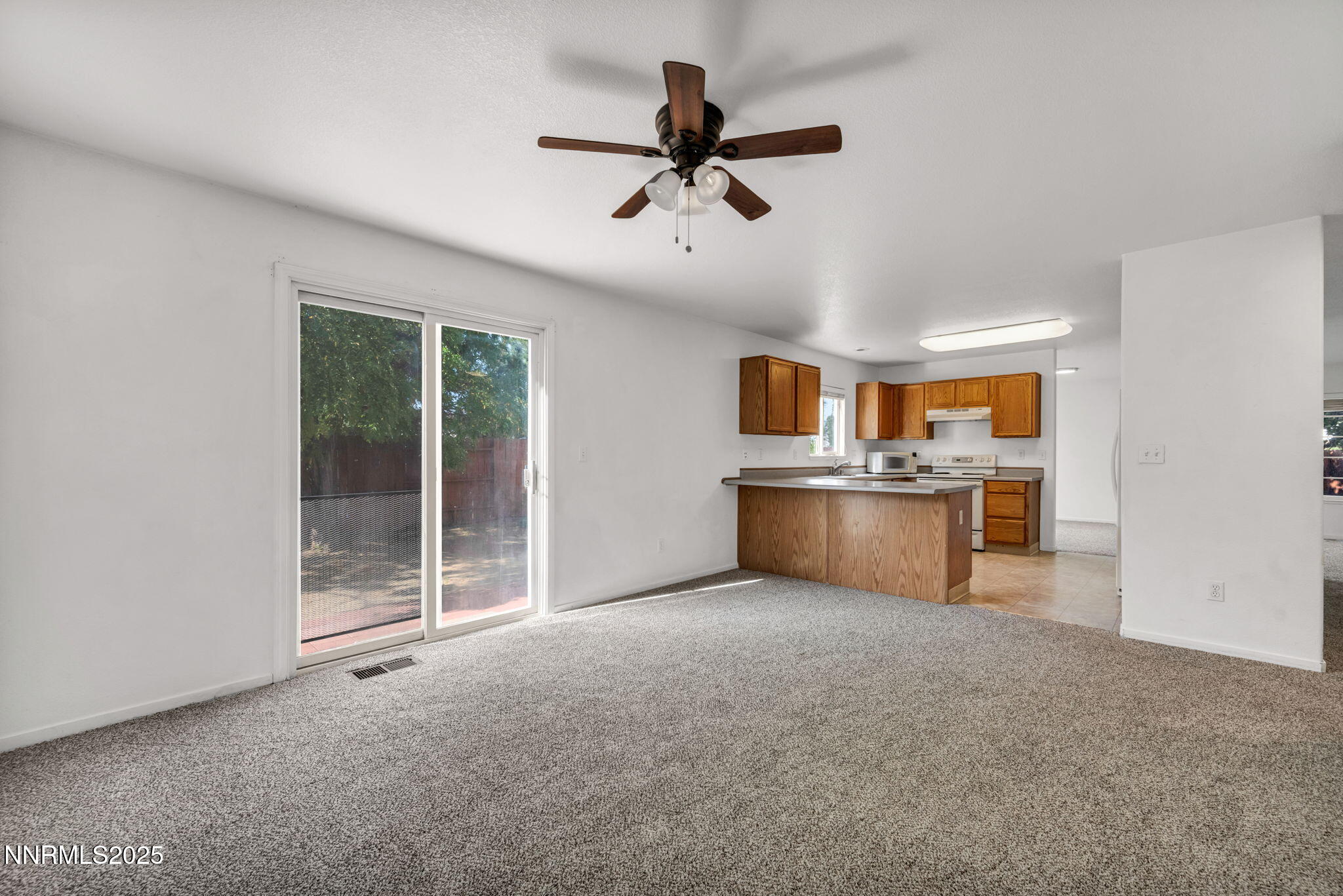 115 Calistoga Court Reno, NV 89508 - Photo 13 of 58 a view of an empty room with a kitchen