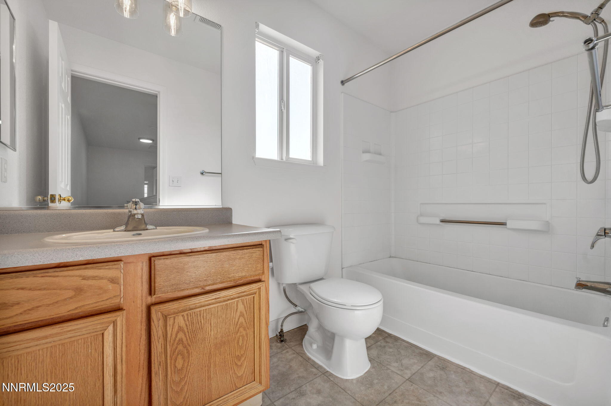 115 Calistoga Court Reno, NV 89508 - Photo 20 of 58 a bathroom with a granite countertop toilet sink and mirror