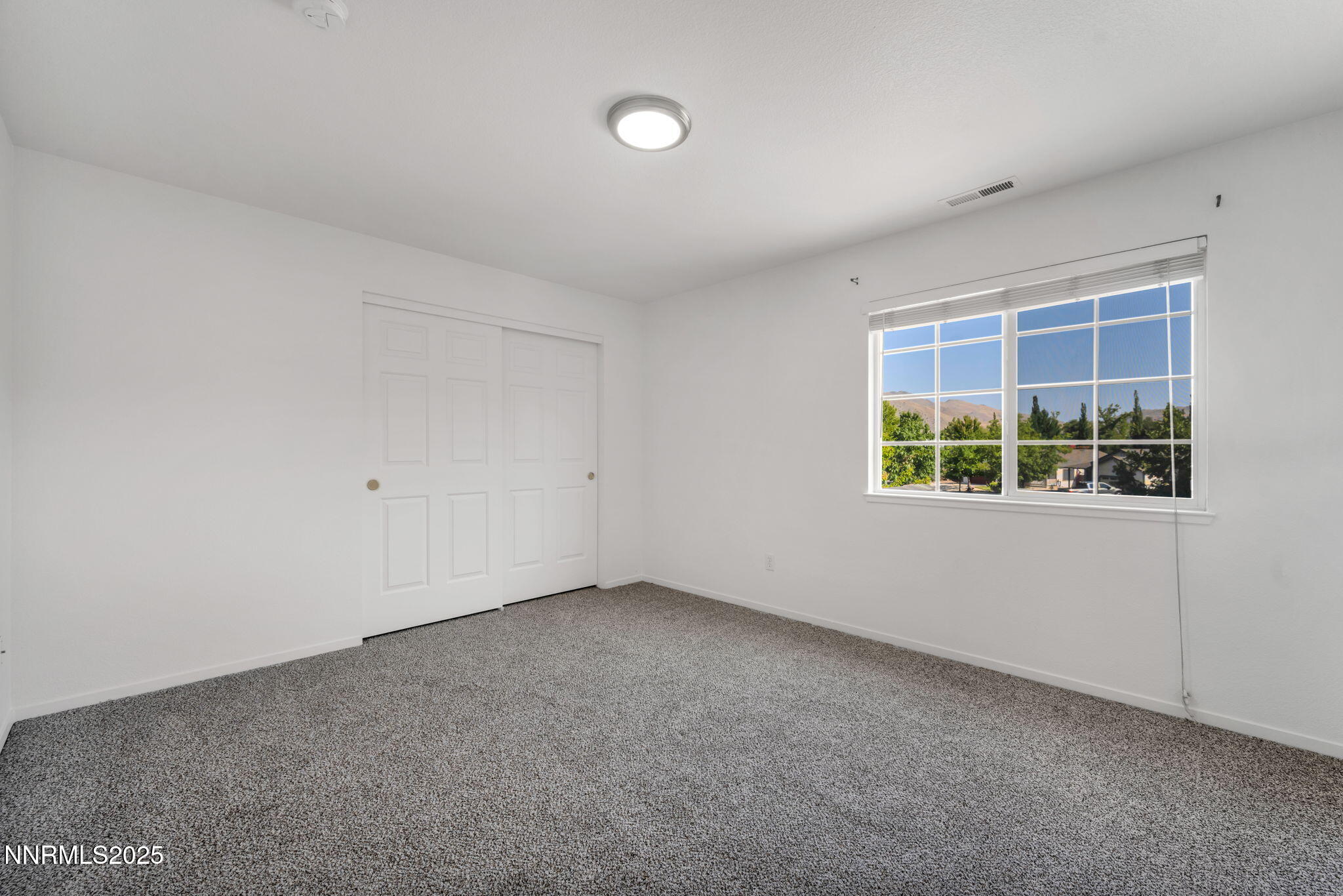 115 Calistoga Court Reno, NV 89508 - Photo 23 of 58 an empty room with a window