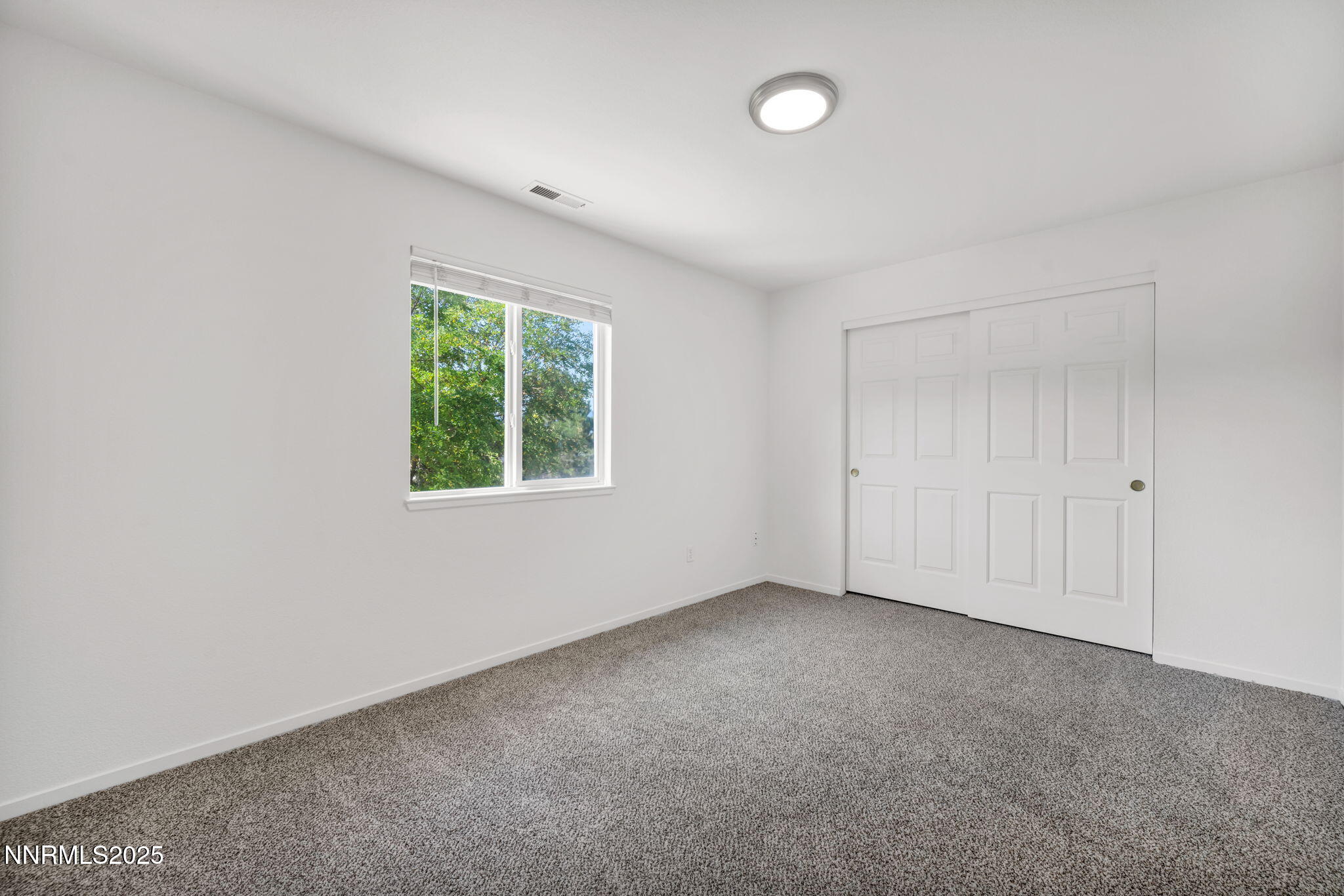 115 Calistoga Court Reno, NV 89508 - Photo 27 of 58 an empty room with windows