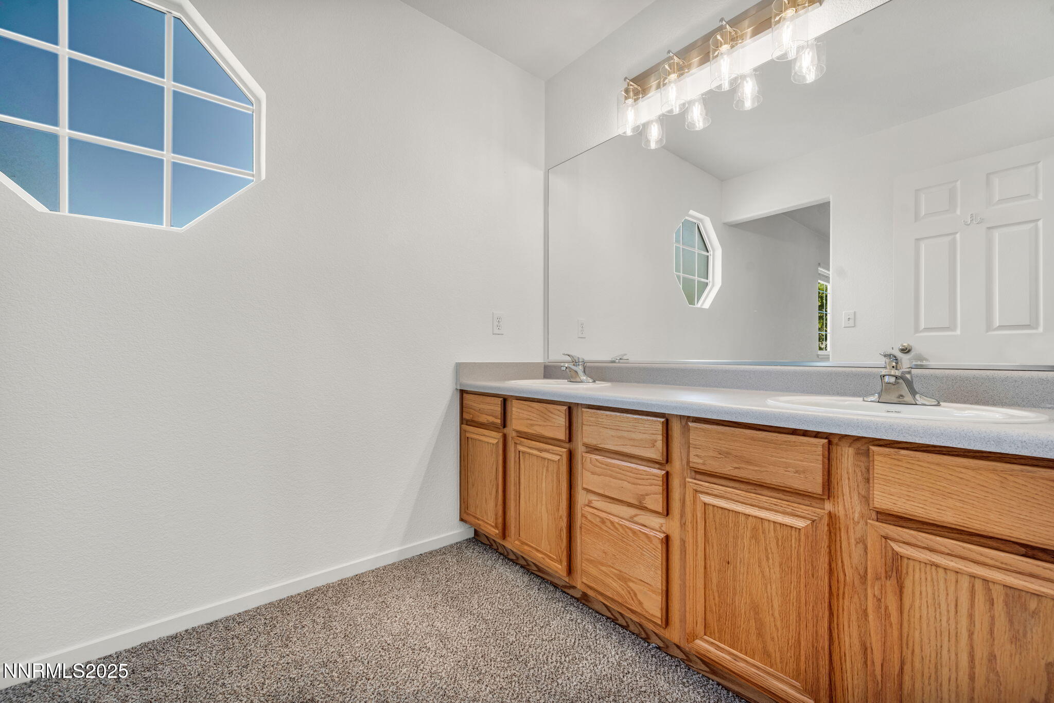 115 Calistoga Court Reno, NV 89508 - Photo 34 of 58 a bathroom with a double vanity sink and a mirror