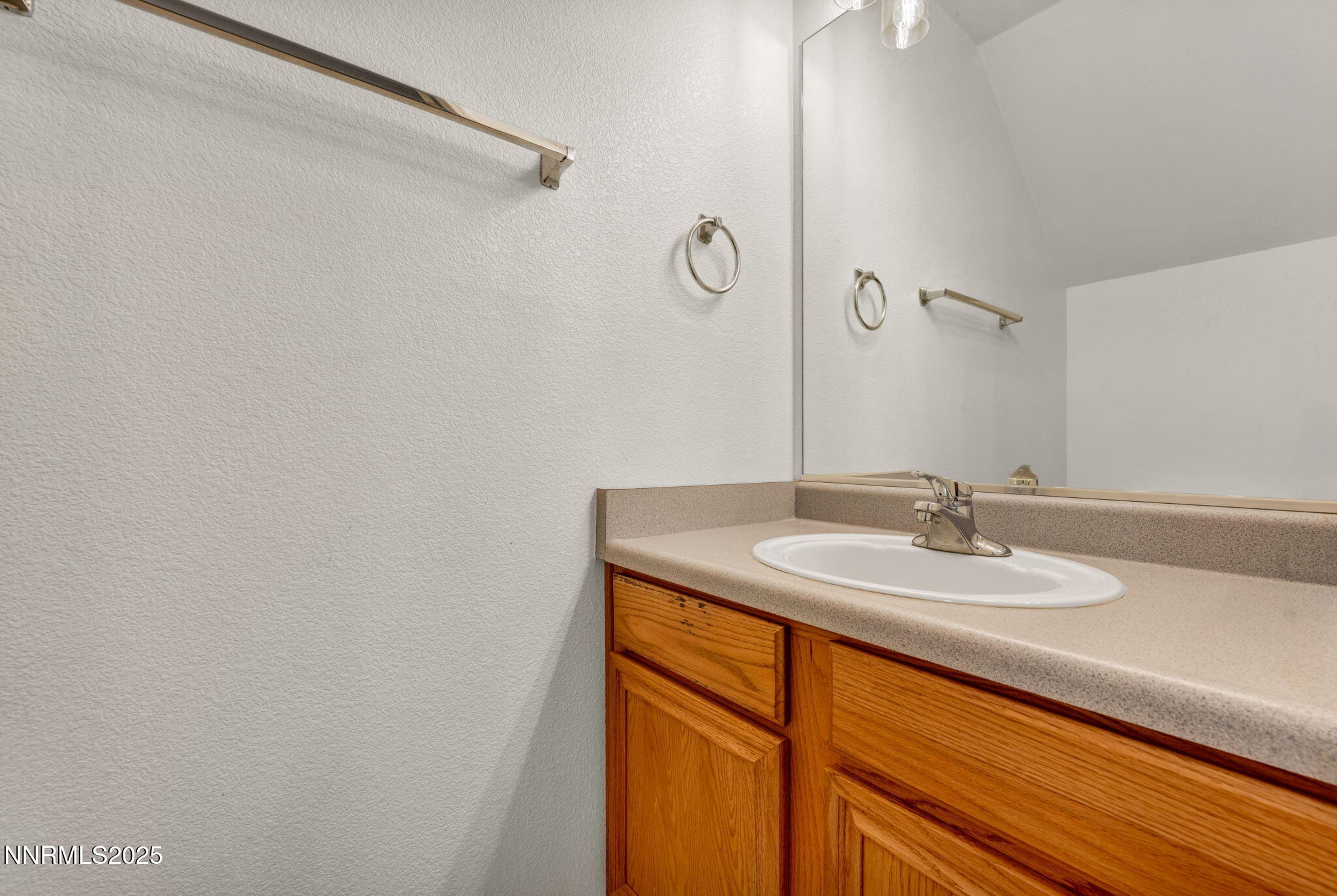 115 Calistoga Court Reno, NV 89508 - Photo 35 of 58 a bathroom with a sink and a mirror