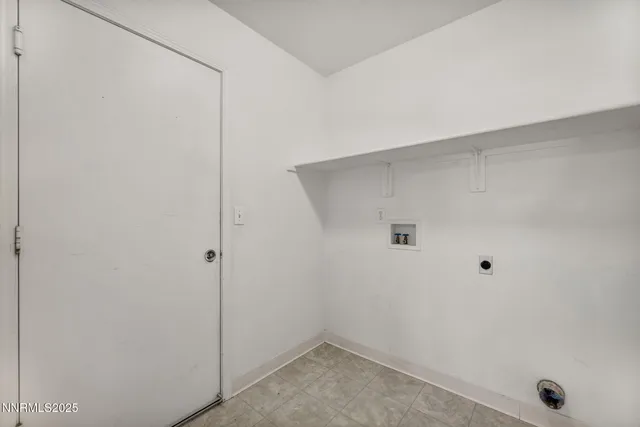 a view of a house with wooden fence and trees