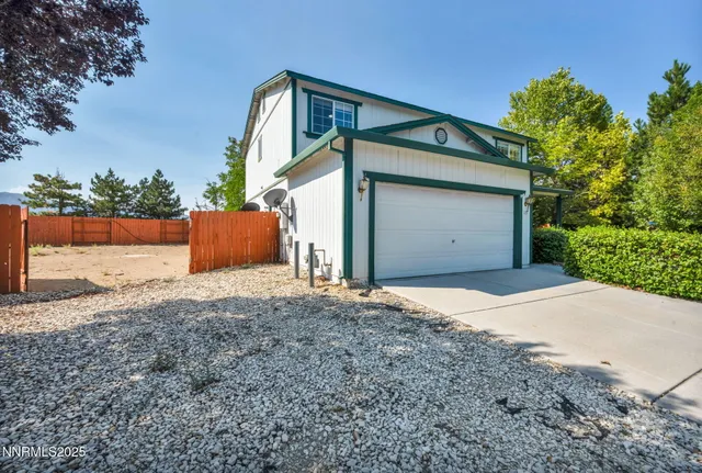a front view of house with a yard and garage