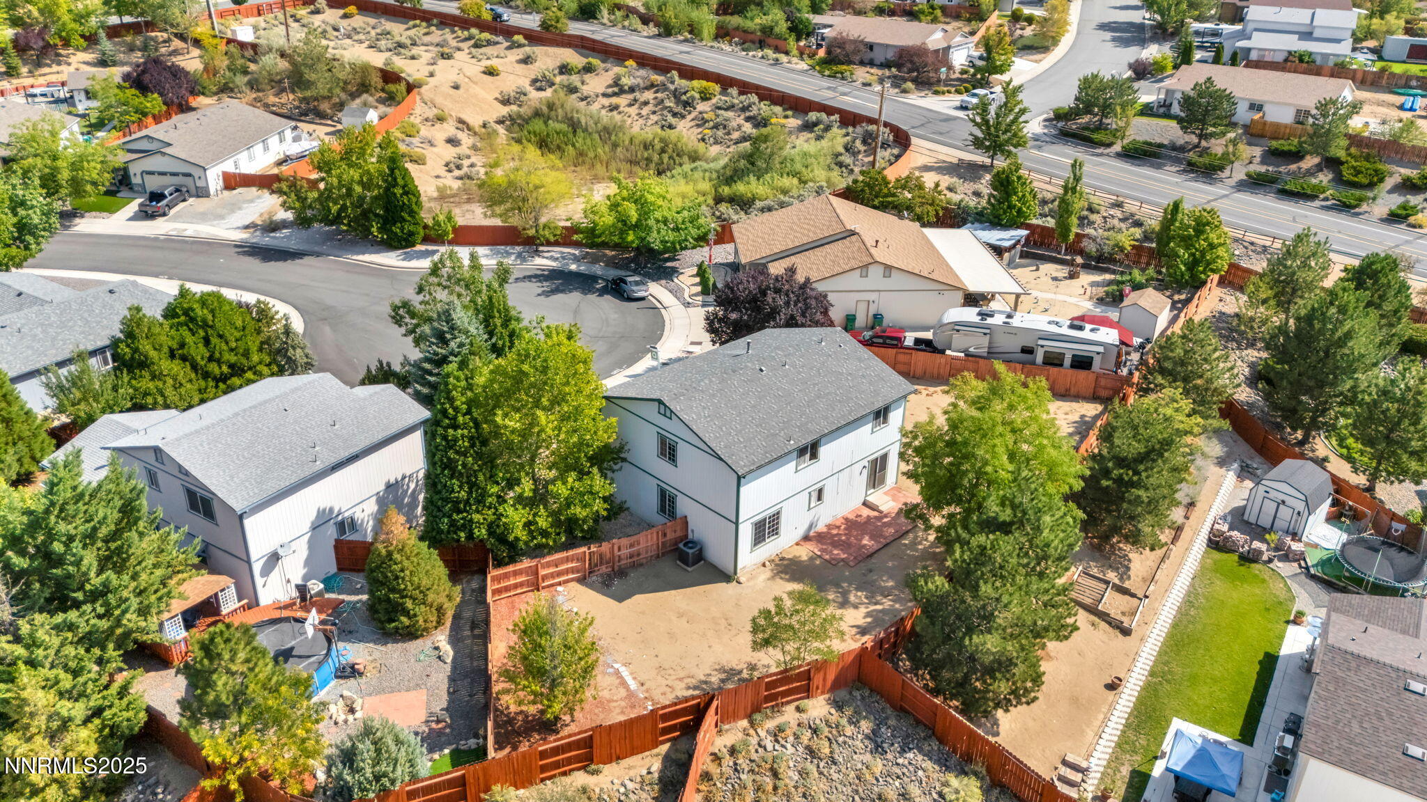 115 Calistoga Court Reno, NV 89508 - Photo 54 of 58 an aerial view of a house with a yard and lake view