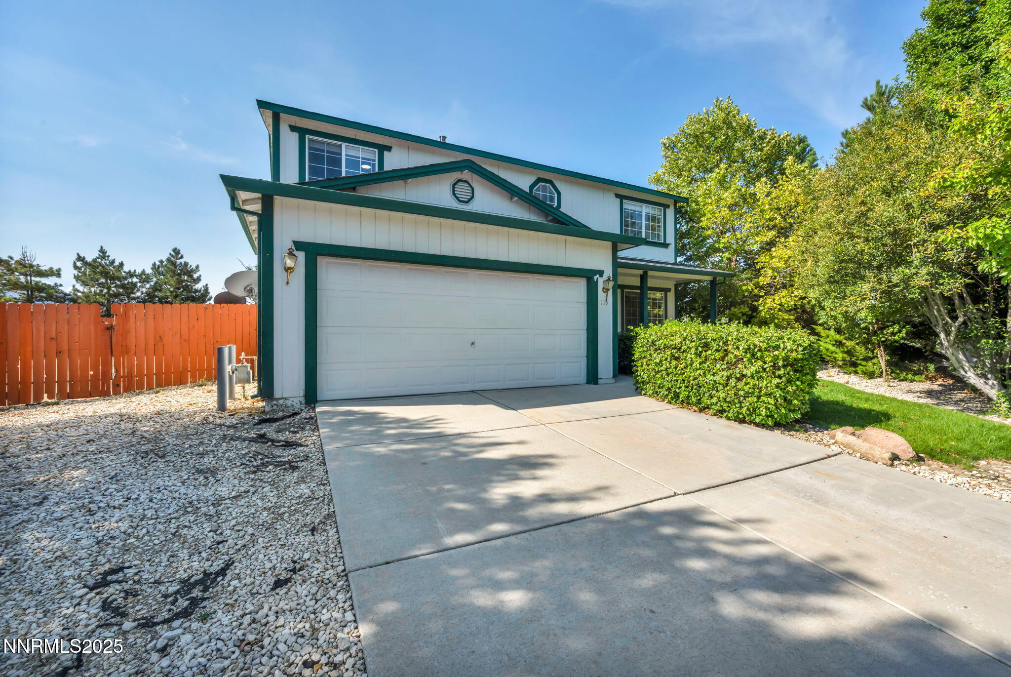 115 Calistoga Court Reno, NV 89508 - Photo 7 of 58 a front view of a house with a yard and garage