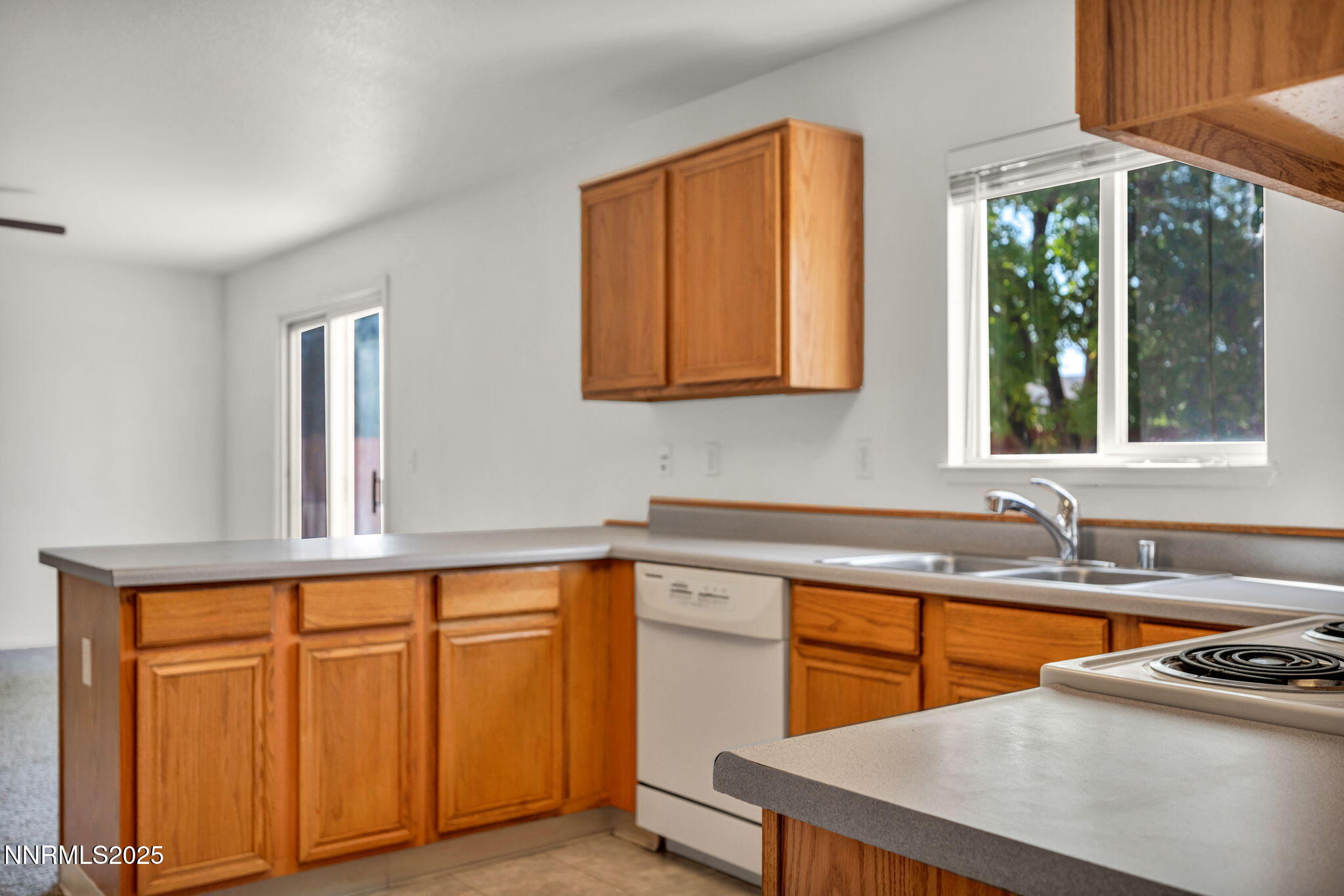 115 Calistoga Court Reno, NV 89508 - Photo 10 of 58 a kitchen with stainless steel appliances granite countertop a sink stove and cabinets