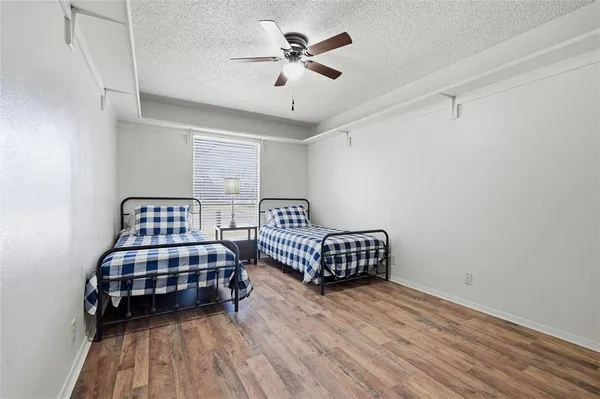 a bedroom with bed and window