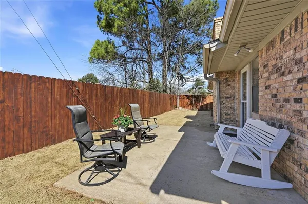 a view of a chairs and table in the patio