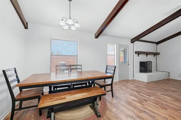 a view of a dining room with furniture and window