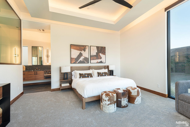 3607 South Cypress Pt Road Hurricane, UT 84737 - Photo 32 of 59 Carpeted bedroom with a ceiling fan, a raised ceiling, access to outside, and ensuite bathroom