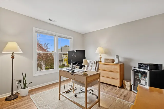 a workspace with furniture and a window