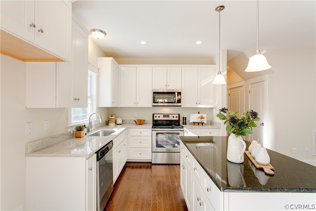 15812 Harrowgate Road Chester, VA 23831 - Photo 11 of 31 a kitchen with a sink a stove a refrigerator and cabinets