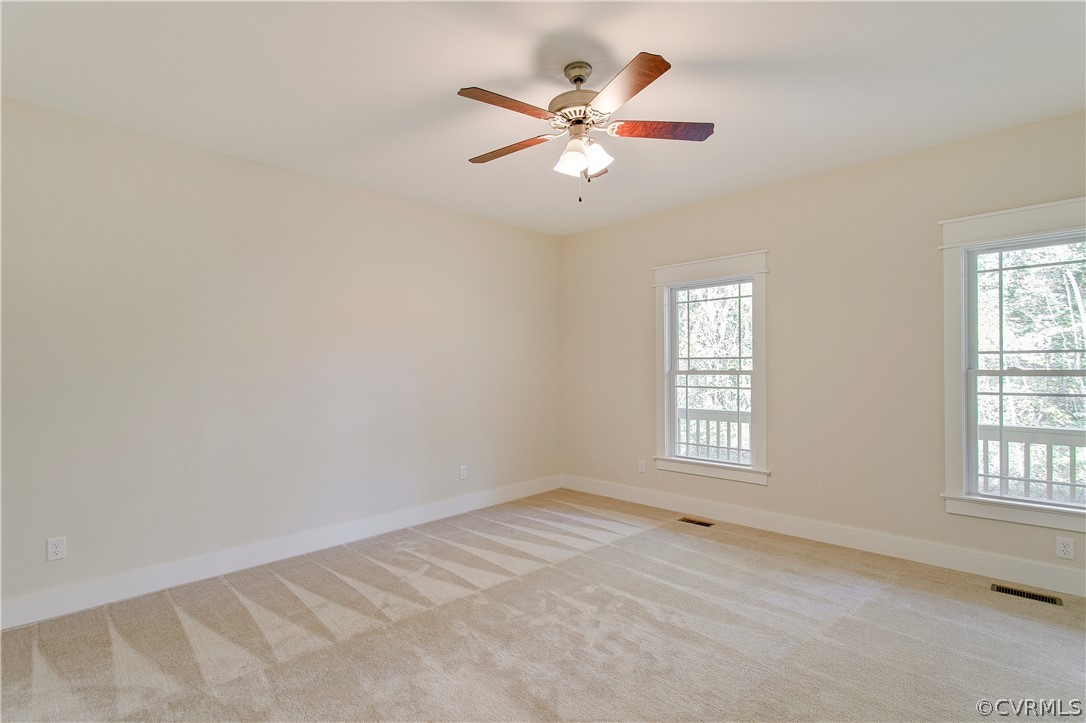 15812 Harrowgate Road Chester, VA 23831 - Photo 15 of 31 an empty room with windows and fan