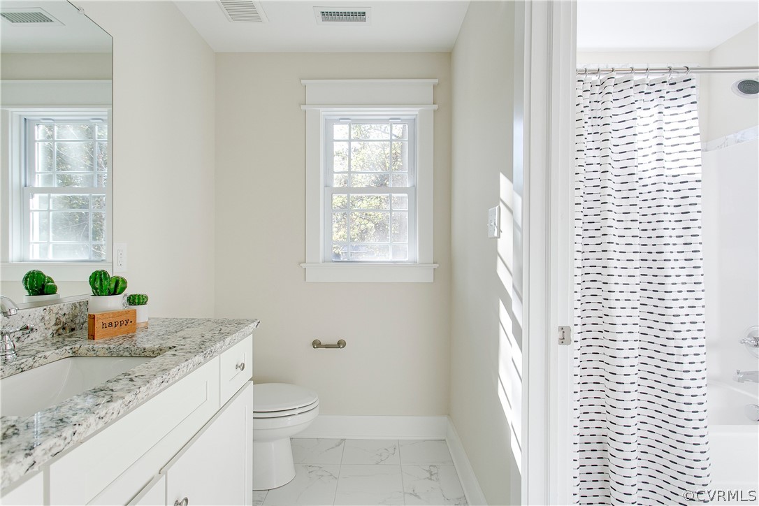 15812 Harrowgate Road Chester, VA 23831 - Photo 23 of 31 a bathroom with a granite countertop sink toilet and shower