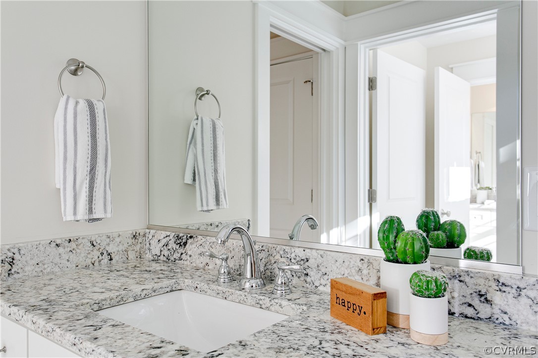 15812 Harrowgate Road Chester, VA 23831 - Photo 24 of 31 a bathroom with a granite countertop sink and a mirror