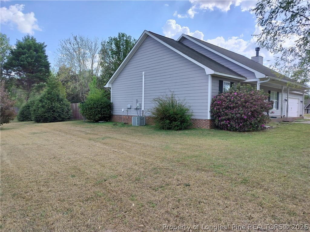 103 Kingsberry Court Raeford, NC 28376 - Photo 2 of 4 a view of a house with backyard and garden