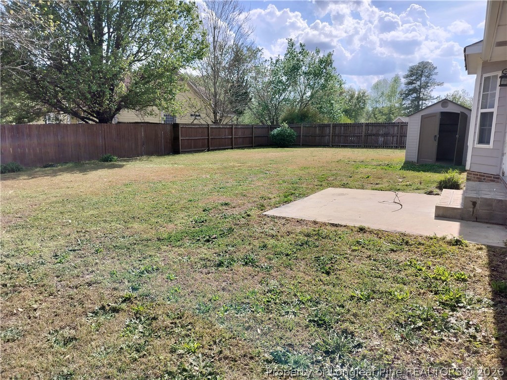 103 Kingsberry Court Raeford, NC 28376 - Photo 3 of 4 a view of a backyard with a garden
