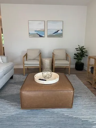 a living room with furniture and a table