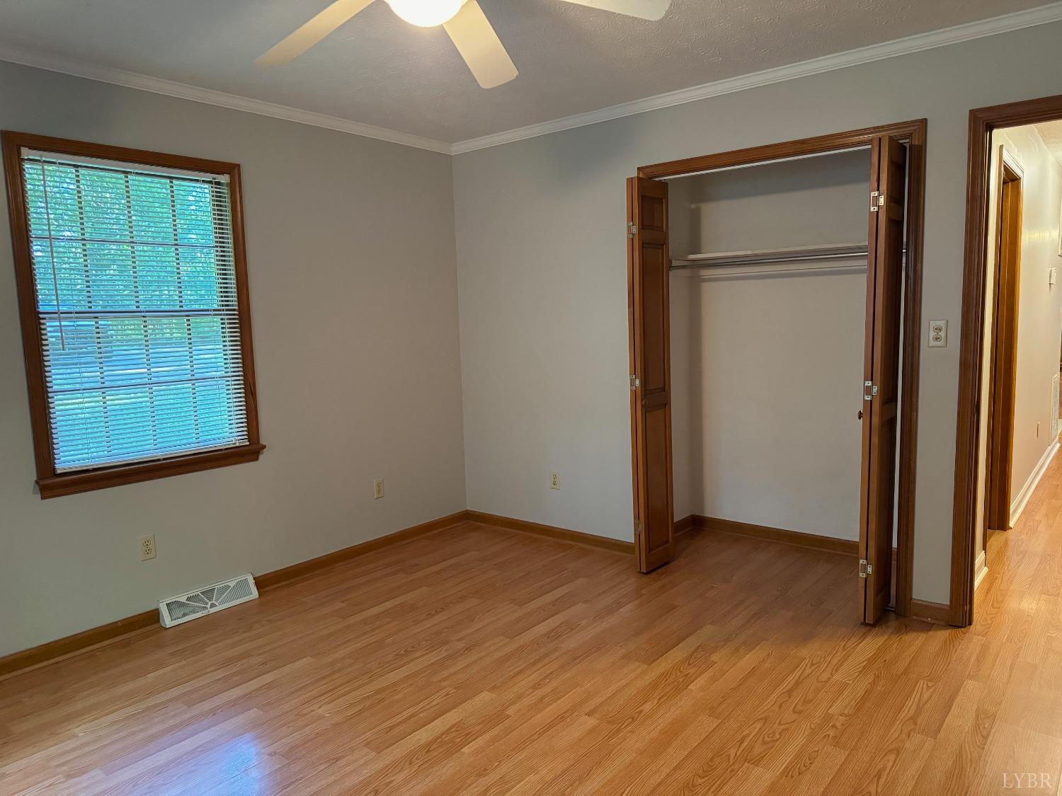 580 First Rock Road Prospect, VA 23960 - Photo 18 of 22 an empty room with wooden floor closet and windows