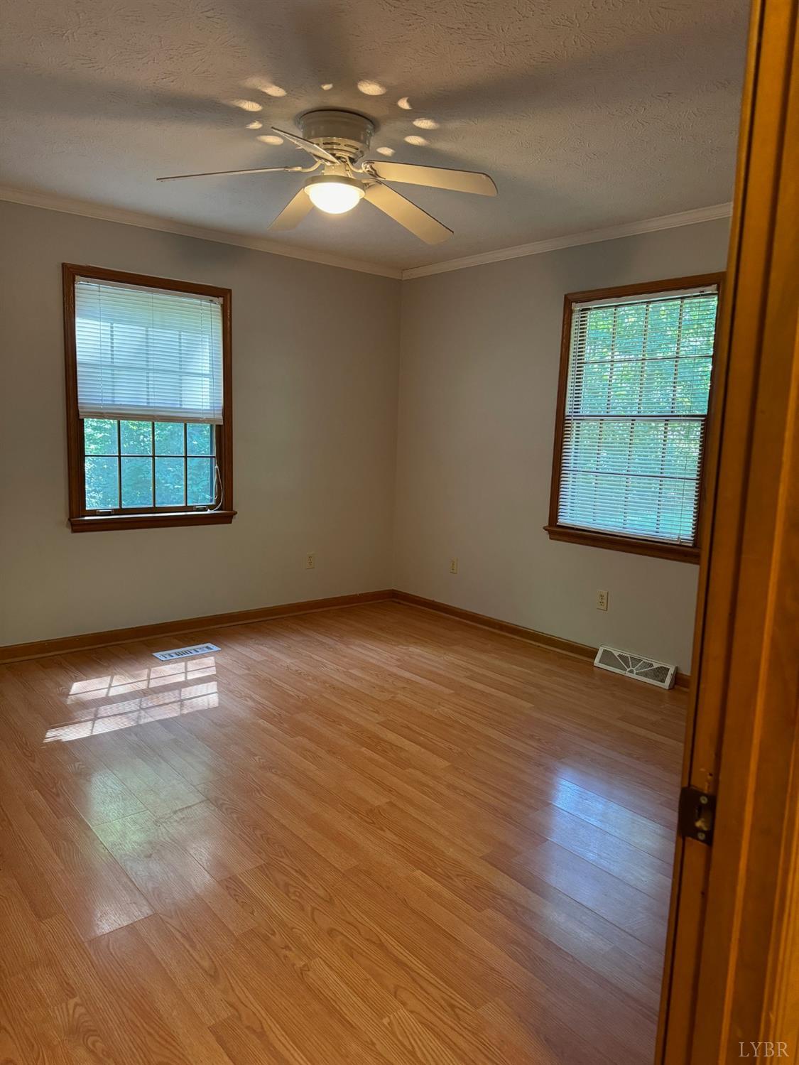580 First Rock Road Prospect, VA 23960 - Photo 19 of 22 a view of an empty room with wooden floor and a window