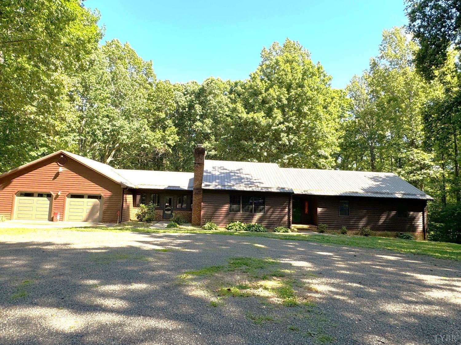 580 First Rock Road Prospect, VA 23960 - Photo 2 of 22 a front view of a house with a yard