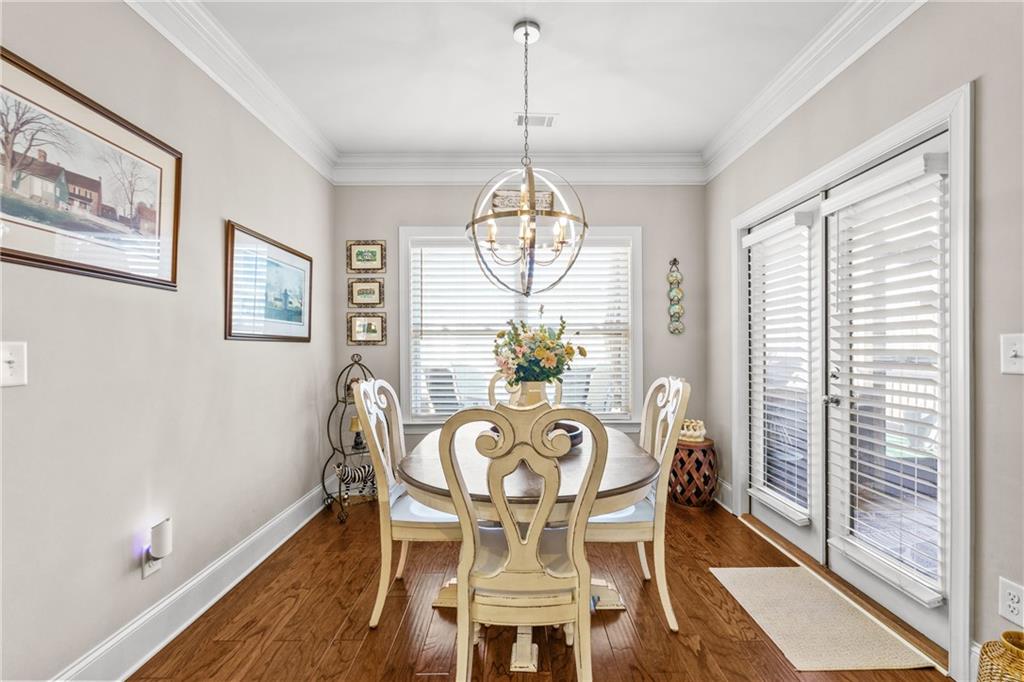 585 Hanover Drive Villa Rica, GA 30180 - Photo 22 of 72 a view of a dining room with furniture window and wooden floor