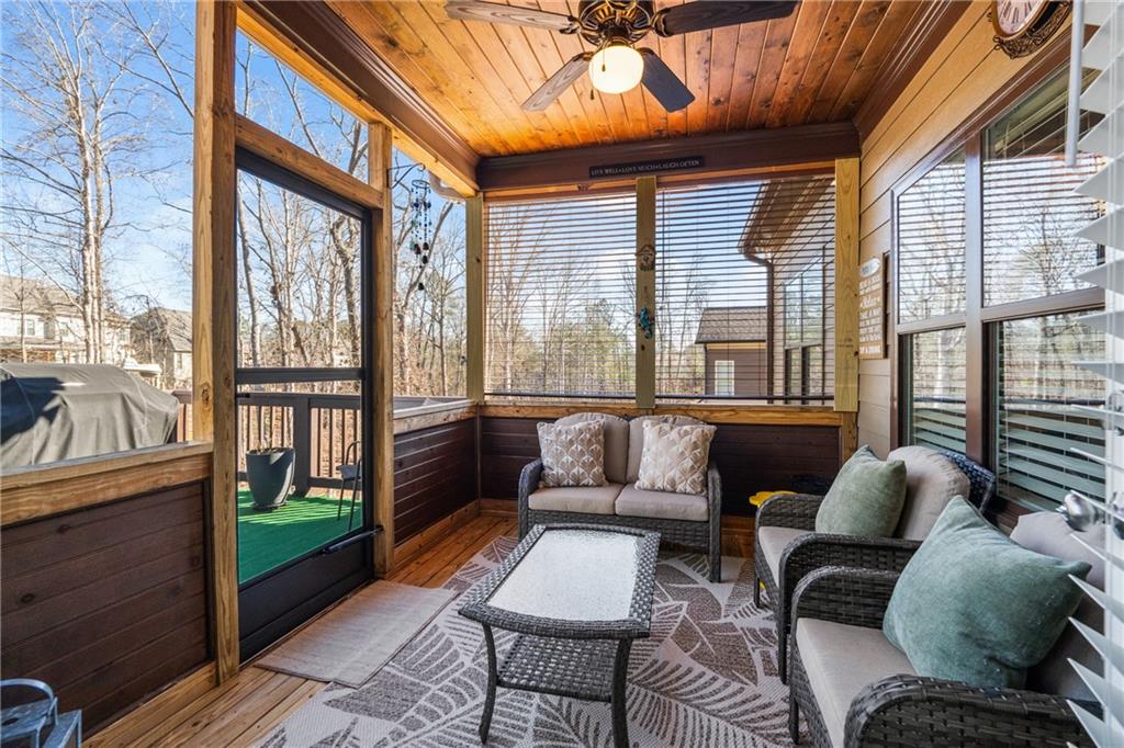 585 Hanover Drive Villa Rica, GA 30180 - Photo 23 of 72 a outdoor living space with furniture and a floor to ceiling window