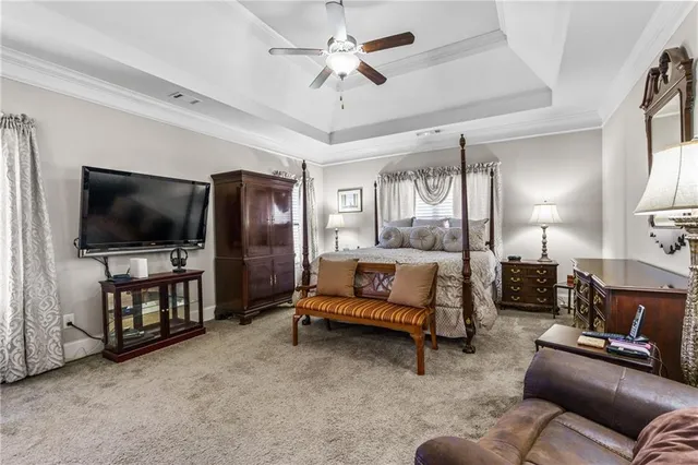 a bathroom with a granite countertop sink mirror and shower