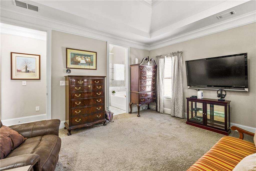 585 Hanover Drive Villa Rica, GA 30180 - Photo 26 of 72 a living room with furniture and a flat screen tv