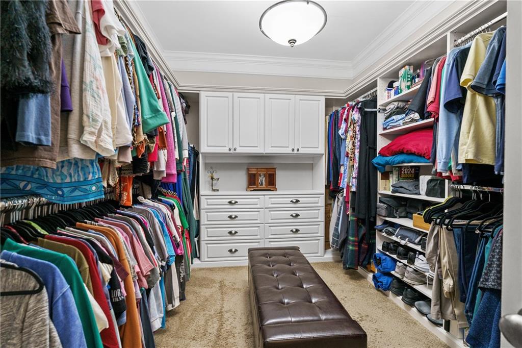 585 Hanover Drive Villa Rica, GA 30180 - Photo 30 of 72 a view of walk in closet with clothes and shoes