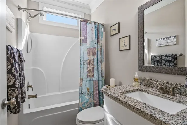 a bedroom with a bed dresser and a window